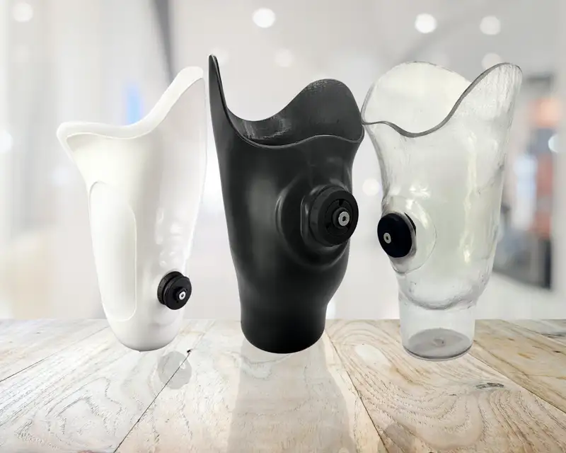 three prosthetics of white and black colors